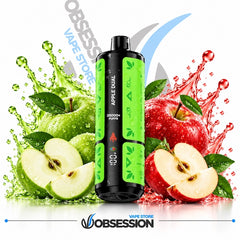 A black and bright green disposable vape device labeled 'APPLE DUAL' stands centered between green and red apple splashes and slices on a white background, with Obsession Vape Store branding visible.