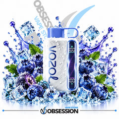 A Vozol vape device with a blue mouthpiece and digital screen, surrounded by ice cubes, blueberries, and water splashes on a white background, with Obsession and Vozol branding.