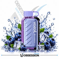 A VOOZ Blueberry Ice disposable vape device in a lavender purple color, surrounded by ice cubes, blueberries, and water splashes on a white background with Obsession branding.