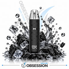 A black disposable vape device with a clear mouthpiece stands upright on a pile of black rocks and ice cubes with water splashes, on a white background with Obsession VAPE Store branding.