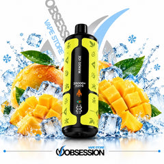 A black and neon yellow disposable vape device labeled 'MANGO ICE' and '35000+ RIFFS' is centered against a dynamic background of sliced mangoes, ice cubes, and water splashes. The brand 'Obsession Vape Store' is visible at the bottom and in the background.