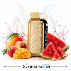 A Vozol automatic vaping device in a metallic gold finish with a black side panel, surrounded by fresh fruit including watermelon slices, mango, and peaches, with a water splash graphic on a white background. The Obsession Vape Store logo is visible at the bottom.