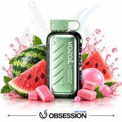 A Vozol Watermelon Bubble Gum disposable vape device in mint green and black, surrounded by watermelon slices, pink bubble gum candies, and water splashes on a white background with 'OBSESSION VAPE STORE' branding at the bottom.