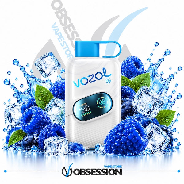 A white Vozol vape device with a blue mouthpiece and digital display screen, surrounded by fresh blueberries, raspberries, mint leaves, and ice cubes with water splashes on a white background. The Obsession Vaap Store logo is visible at the bottom.