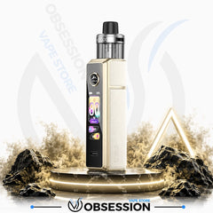 A gold and black Obsession vape device with a digital display screen, standing on a glowing circular platform with rocks and smoke effects against a white background with Obsession branding.