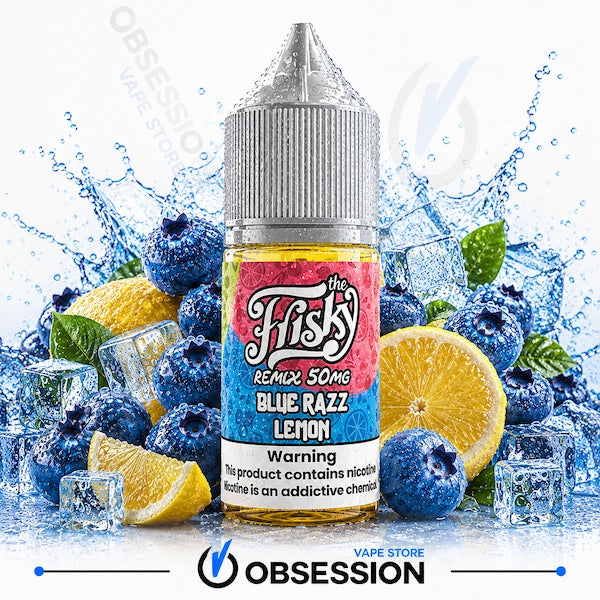 A bottle of e-liquid centered against a white background with a fruit and ice splash composition. The bottle label reads 'The Fisky Remix 50mg Blue Razz Lemon' and shows blueberries, lemon slices, mint leaves, and ice cubes around it.