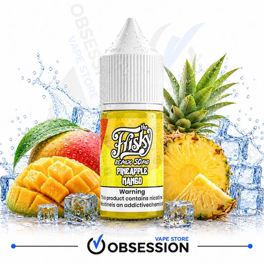 A bottle of e-liquid centered in front of fruit and ice, with a white cap and a yellow label reading 'The Fiskz Remix Song Pineapple Mango.' Sliced pineapple, mango pieces, and ice cubes surround the bottle on a white background with water splashes.