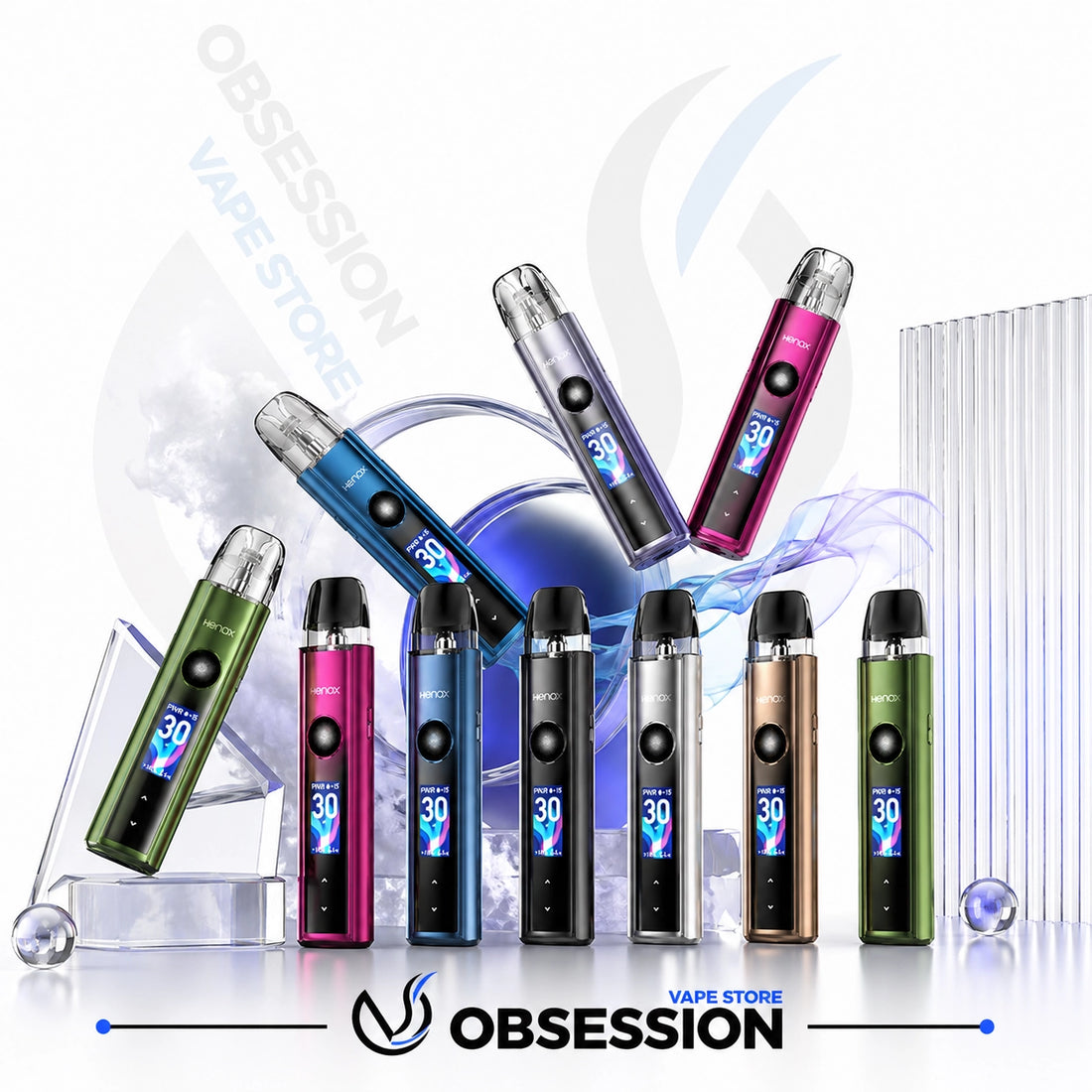 Six disposable vape devices in assorted colors (green, pink, blue, black, silver, bronze, and green) are arranged in a dynamic studio composition with digital smoke effects, ice cubes, and a clear acrylic stand. The brand name 'OBSESSION' is visible at the bottom along with 'OBSESSION VAPE STORE' in the background.