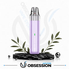 A lavender purple disposable vape device with a clear mouthpiece, displayed on a black marble base with decorative green leaves and metallic spheres. The Obsession Vape Store logo is visible at the bottom.
