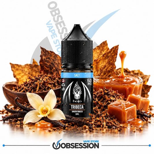 A 30ml bottle of Halo Tribeca Salt smooth tobacco e-liquid (50mg) with a water droplet-covered black dropper cap, centered among shredded cured tobacco leaves, large dried tobacco leaves, a white vanilla flower with vanilla beans, and glistening caramel cubes alongside a bowl of rich caramel drizzle over a warm reflective surface on a white background, framed with a subtle background watermark and the "OBSESSION VAPE STORE" logo along the bottom border. 