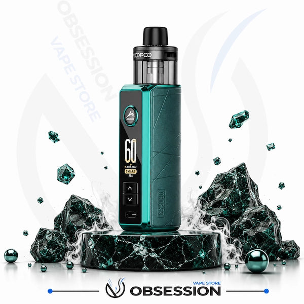 A vape device with a dark teal and black body, standing on a black marble pedestal with decorative rocks and smoke effects. The device has a digital display showing '60' and the brand 'VOPOCO' is visible on the tank.