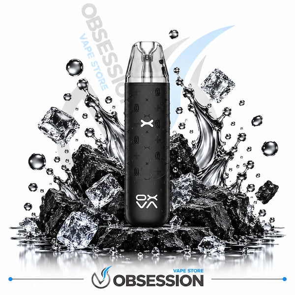 A black disposable vape device with a clear mouthpiece stands upright on a pile of black rocks and ice cubes with water splashes, on a white background with Obsession VAPE Store branding.