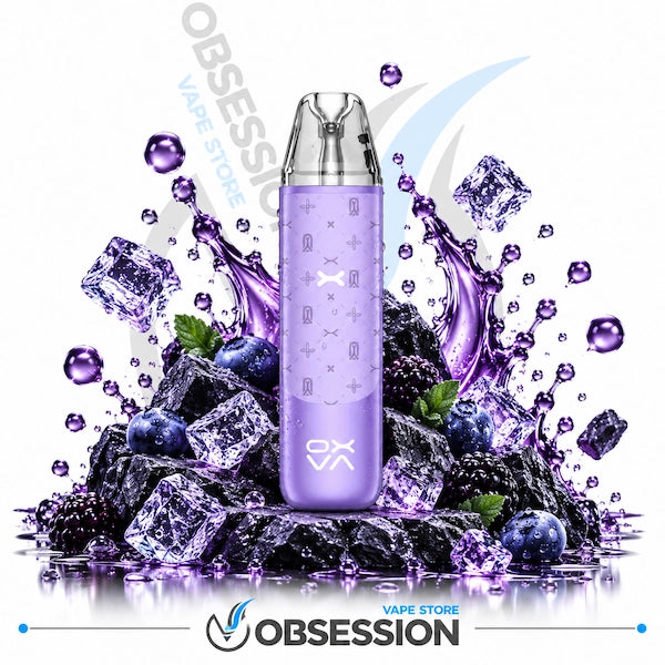 A purple disposable vape device with a clear mouthpiece, centered over a pile of ice cubes, blueberries, and blackberries on a white background. Purple liquid splashes and droplets surround the device.