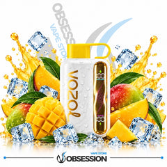 A white VOOZ vape device with a yellow mouthpiece and gold branding, surrounded by fresh mango slices, green mangoes, ice cubes, and golden liquid splashes on a white background. The Obsession Vape Store logo is visible at the bottom.