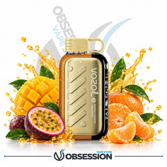 A Vozol disposable vape device in a metallic gold finish with a black side accent, surrounded by fresh fruit slices and splashes of orange juice on a white background. The image features 'Obsession' branding at the bottom and a faint 'Obsess Vapes' watermark in the background.