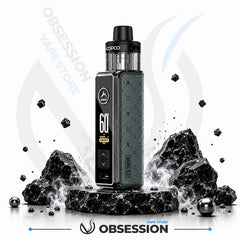 A black and dark gray VooPoo vape device stands on a pedestal surrounded by black rocks and floating charcoal pieces, with Obsession VapeStore branding in the background.