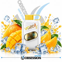 A white Vozol vape device with a yellow mouthpiece and a gold display screen, surrounded by fresh mango slices, green leaves, ice cubes, and orange juice splashes on a white background. The Obsession Vape Store logo is visible at the bottom.