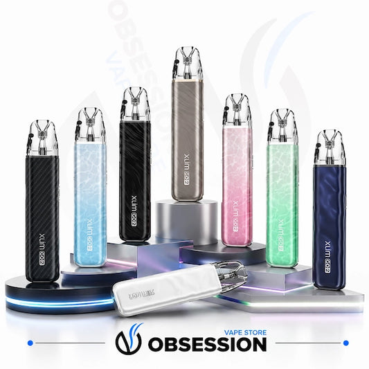 Six EDS LITX vape devices in various colors (black carbon fiber, light blue marble, black marble, rose gold, pink marble, mint green marble, dark blue marble) are displayed on silver pedestals, with a white lockable battery in the foreground. The Obsession Vape Store logo is visible at the bottom.