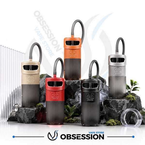 Five disposable vape devices in different colors (beige, orange, red, black, and silver) arranged on rocks with decorative plants and a clear case, with the Obsession Vape Store logo at the bottom.