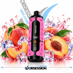 A pink and black disposable vape device labeled 'PEACH ICE' stands in the center against a white background, surrounded by sliced peaches, whole peaches, ice cubes, and pink liquid splashes. Large diagonal 'OBSESSION VAPE STORE' text and logo appear behind and below the product.