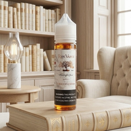Bottle of Ripe Vapes Tobacco Cream on a book with a cozy room background