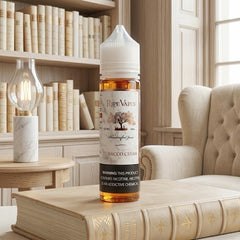 Bottle of Ripe Vapes Tobacco Cream on a book with a cozy room background