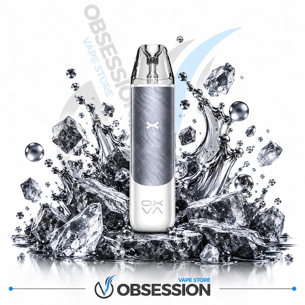 A disposable vape device with a brushed silver and white body stands upright in front of a dramatic splash of ice and water on a white background. The Obsession brand logo is visible at the bottom, and 'OBSESSION VAPE STORE' appears as a watermark in the background.