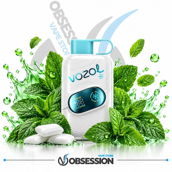 A white Vozol vape device with a light blue mouthpiece and digital screen, surrounded by green mint leaves, water droplets, and white candy pieces on a white background with Obsession and Vozol branding.