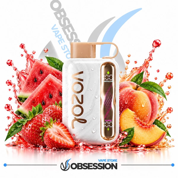 A white VOZOL vape device with a gold side panel and peach-colored mouthpiece, surrounded by fresh watermelon slices, strawberries, peaches, and water splashes on a white background. The Obsession / Obsess vape store branding is visible.