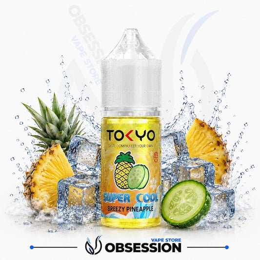TOKYO vape juice bottle with pineapple and cucumber slices on a white background