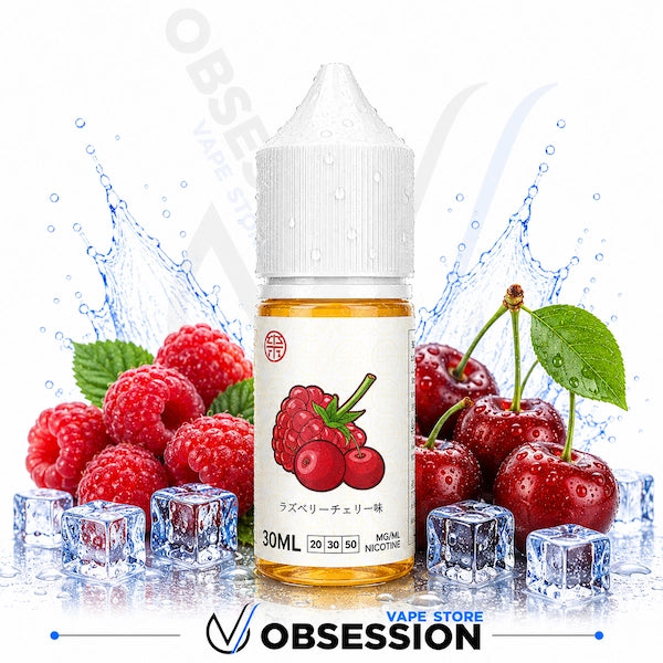 Vape juice bottle with raspberry and cherry design surrounded by berries and ice cubes on a white background.