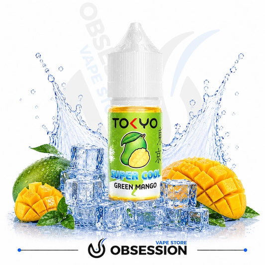 TOKYO vape juice bottle with green mango flavor surrounded by mangoes, lime, and ice cubes on a white background.
