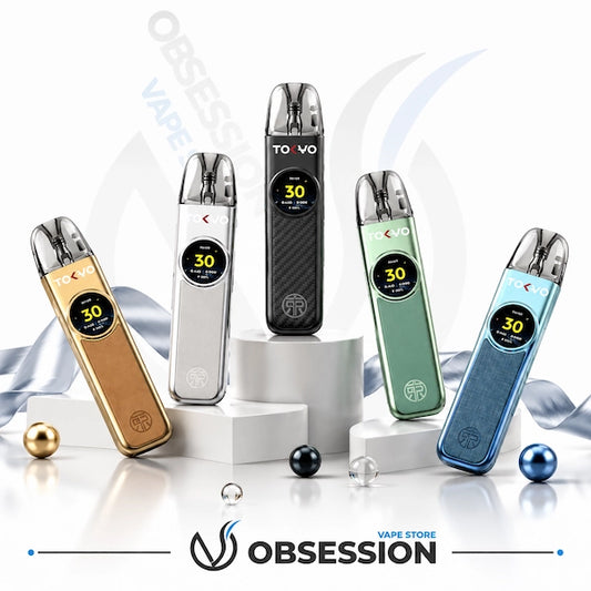 Five Tokyo Tokyo TikPod 30W vape devices in different colors (gold, silver, black, mint green, and blue) arranged on white pedestals with decorative ribbons and glass balls. The Obsession VAPE Store logo is visible at the bottom.