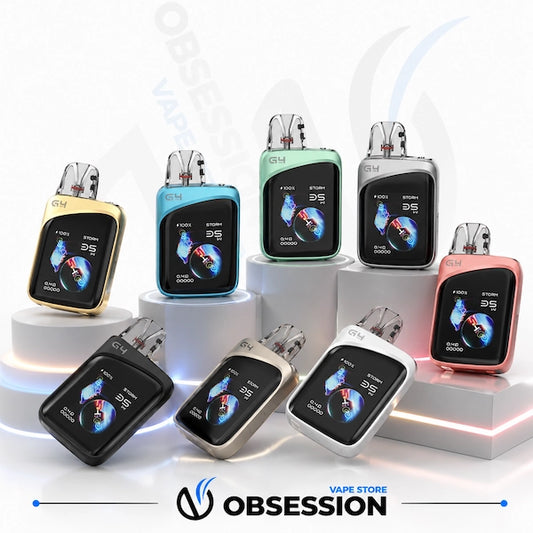 Six small electronic vape devices displayed on white pedestal risers against a clean white studio background. The devices come in multiple metallic finishes: gold, blue, silver, black, white, and rose gold.