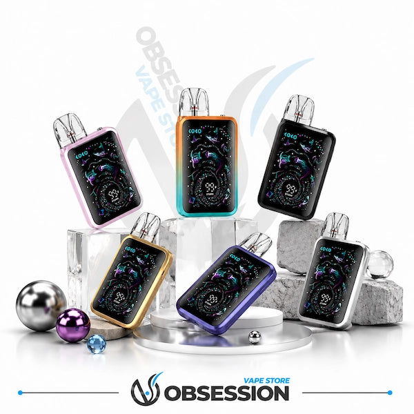 Six Obsession vape devices with different metallic frame colors (pink, teal, black, gold, purple, silver) arranged on clear acrylic blocks with decorative metallic balls on a white background.