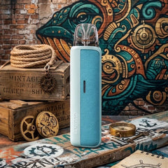 Blue vape device on a wooden surface with decorative background