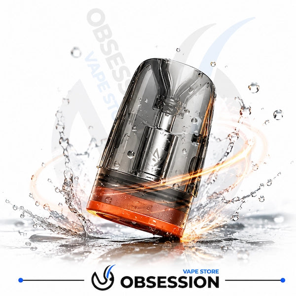 A transparent smoky vape pod or disposable vape device with orange liquid visible at the bottom, shown mid-splash on a white background with water droplets and flame-like orange effects. Obsession branding appears at the bottom.