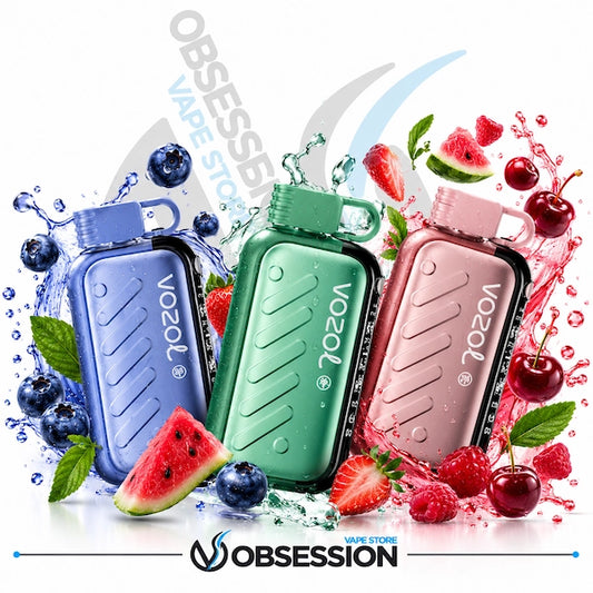 Three Vozol vape devices in blue, green, and pink, surrounded by water splashes and fresh fruit like watermelon, strawberries, blueberries, raspberries, and cherries on a white background, with the Obsession vape store logo at the bottom.
