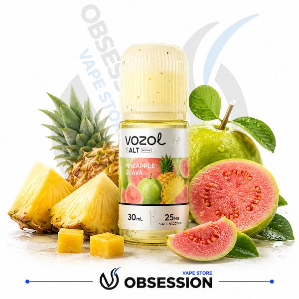 A bottle of Vozol Alt Pineapple Guava e-liquid centered on a white background, surrounded by fresh pineapple slices, a whole pineapple, guava fruit pieces, and green leaves. The bottle label shows the Vozol brand and flavor text.