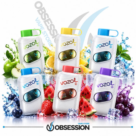 Six Vozol disposable vape devices in assorted flavors, arranged in a dynamic group with fresh fruit slices, ice cubes, and colorful liquid splashes on a white background. The devices feature white bodies with colorful accents (green, yellow, blue, red, brown, purple) and are branded with the Vozol logo.