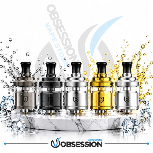 Five vape tank devices lined up on a white marble slab with water splashes and ice cubes. The devices come in metallic silver, dark gray, and gold finishes, each with a black mouthpiece.
