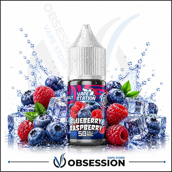 Vape Station Blueberry Raspberry Super Ice Salt 30ml.webp shows a Vape Station Blueberry Raspberry Super Ice SaltNic vape juice bottle with a clear, droplet-covered cap. The bottle is positioned centrally and surrounded by an energetic, ice-cooled arrangement of berry flavors