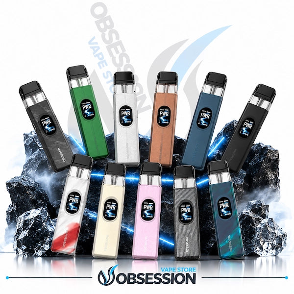 Ten PWR X disposable vape devices in various colors are arranged in two rows on a reflective surface with dark rocks and blue light effects. The top row has five vapes in black, green, silver, bronze, and dark blue.