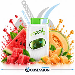 A white Vozol vape device with a green mouthpiece and green logo, surrounded by watermelon slices, cantaloupe, and orange juice splashes on a white background, with Obsession and Vozol branding visible.