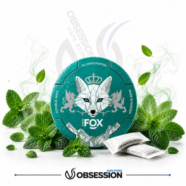 Teal packaging with fox design surrounded by mint leaves and a small packet on a white background.