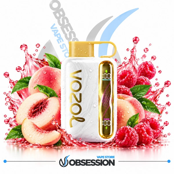 A white Vozol vape device with gold accents and a gold cap, surrounded by fresh peach slices, whole peaches, raspberries, and mint leaves with red liquid splashes. The background is white with Obsession Vape Store branding.
